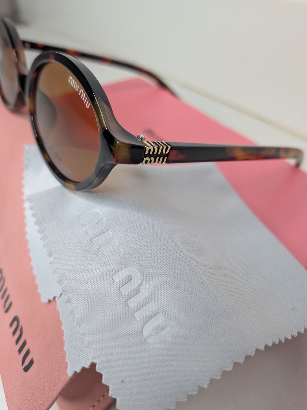 Miu Miu Tortoiseshell Oval Sunglasses in Brown - Picture 3 of 11